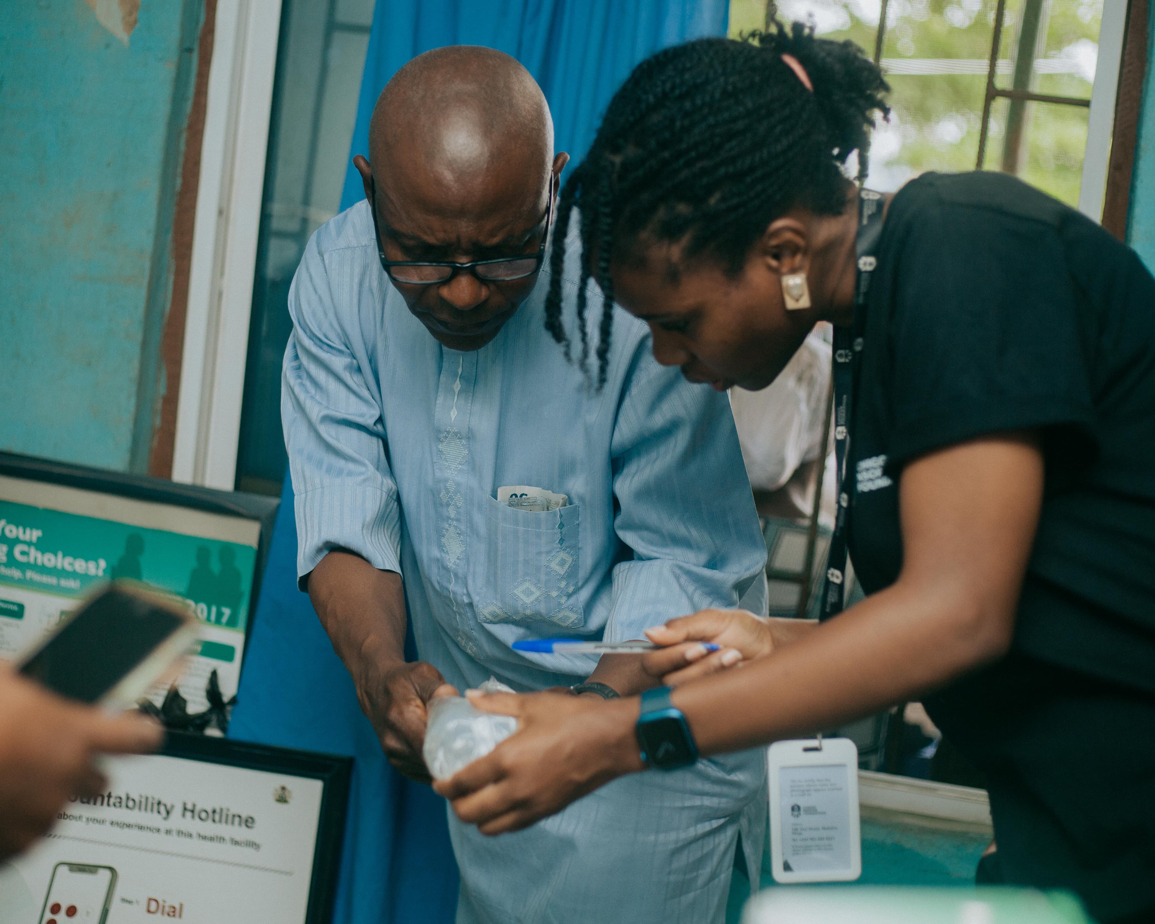 CFO team member supporting a patient during a community healthcare outreach