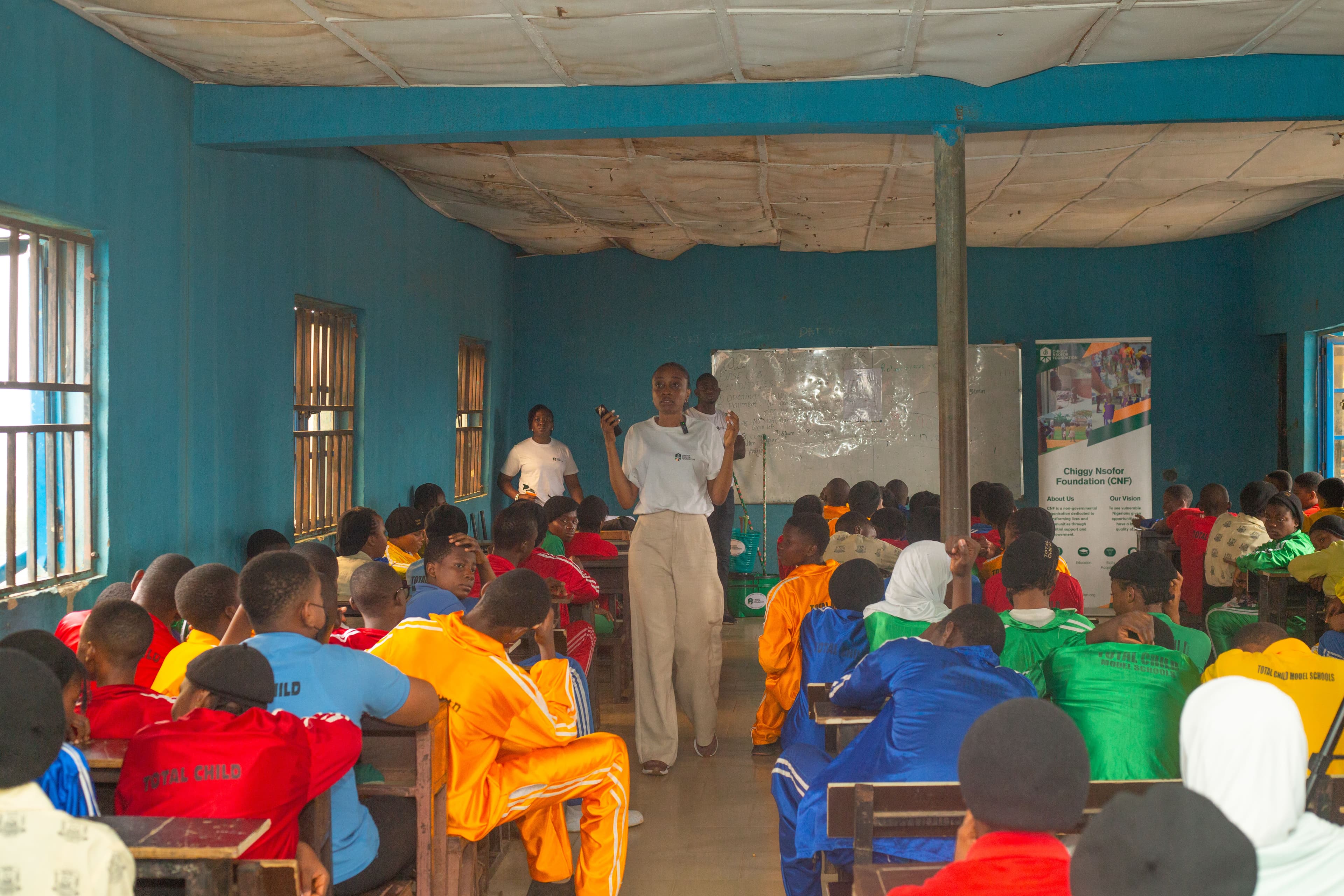 CFO facilitator leading a classroom session with students in partner schools